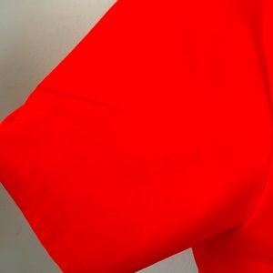 Solid orange V-neck scrub top